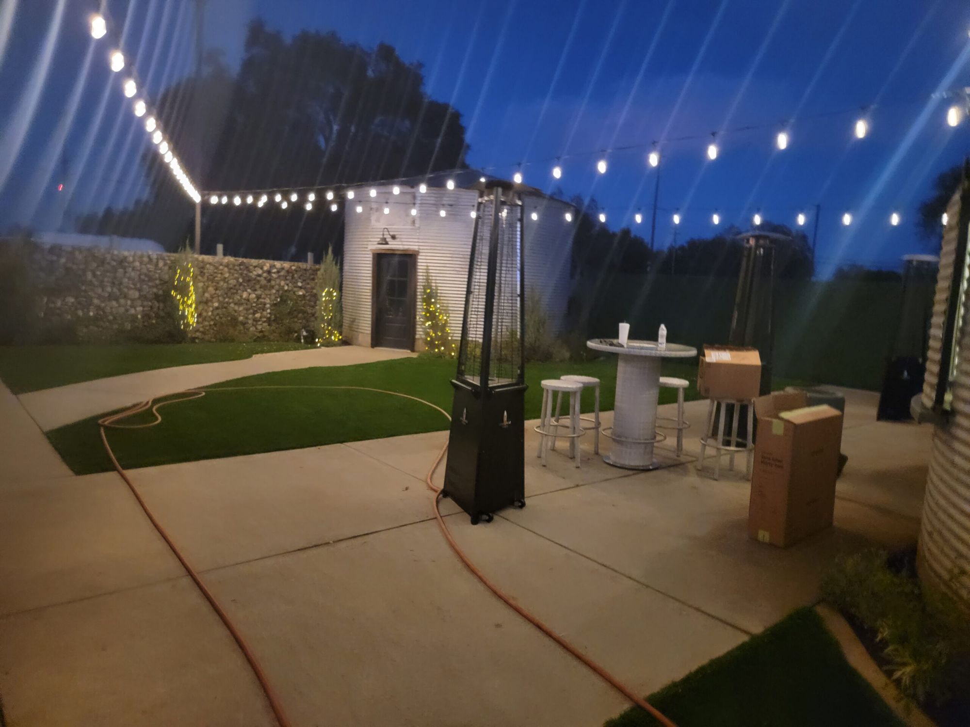 Courtyard at The Silos with string lights and lush landscaping